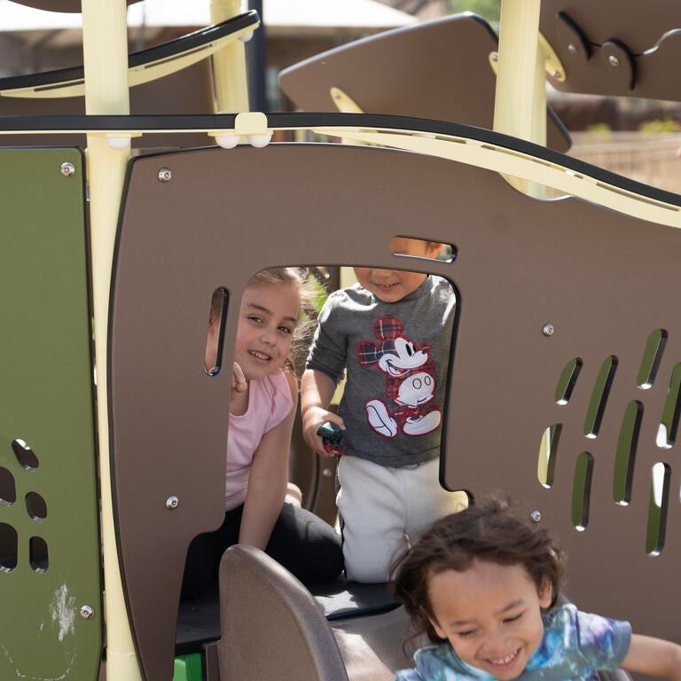 children playing on CECE play yard