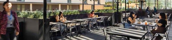 students eating on the outdoor glasgow patio